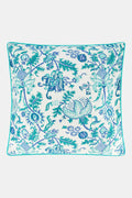 The Amanda Decorative Pillow by Roller Rabbit features an intricate blue and teal floral and bird hand-blocked print on white 100 cotton, finished with blue piping along the edges.