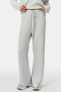 A person wearing the Roller Rabbit Cable Knots Olivia Pant in light gray, featuring a drawstring waist, paired with a matching top and white sneakers. The photo is cropped from shoulders down against a white background.