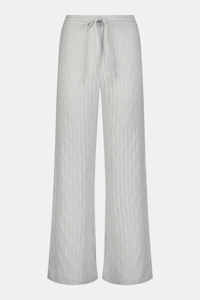 A person wearing the Roller Rabbit Cable Knots Olivia Pant in light gray, featuring a drawstring waist, paired with a matching top and white sneakers. The photo is cropped from shoulders down against a white background.