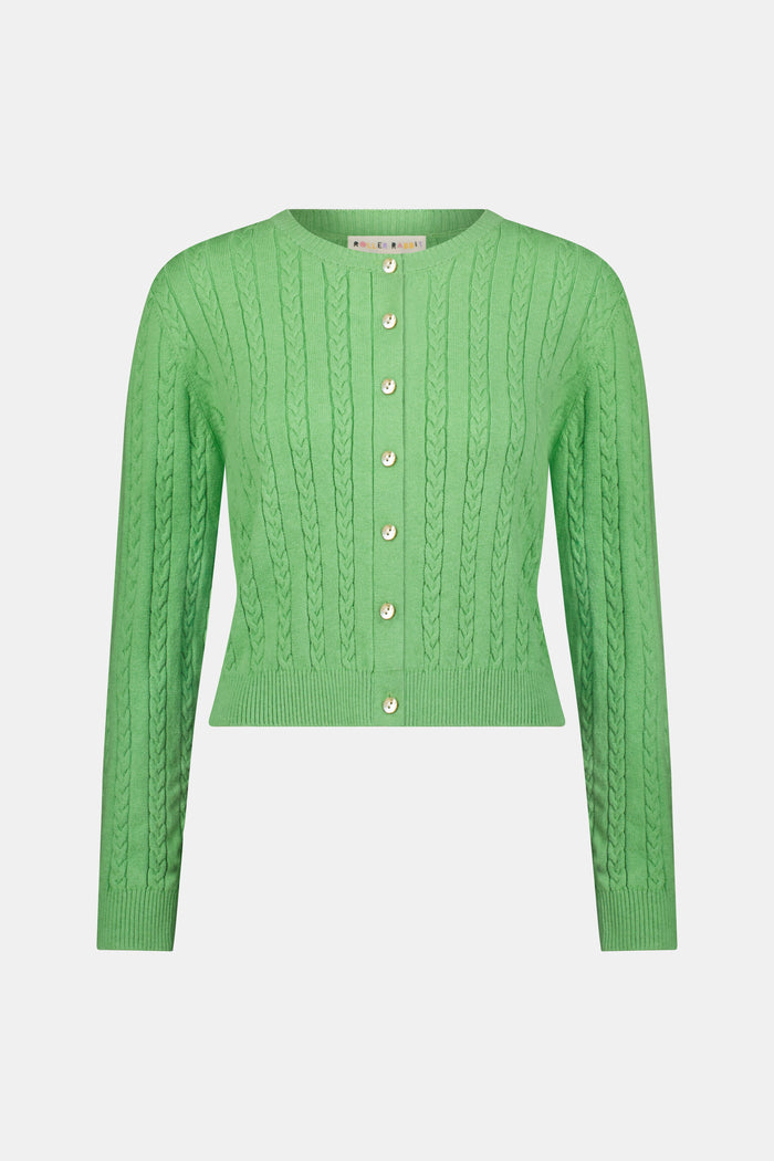 The Roller Rabbit Cable Stripe Moxie Cardigan is a bright forest green, long-sleeve cardigan featuring a cable-knit design. Crafted from soft cotton cashmere, it has a crew neckline and gold buttons down the front, shown against a plain white background.