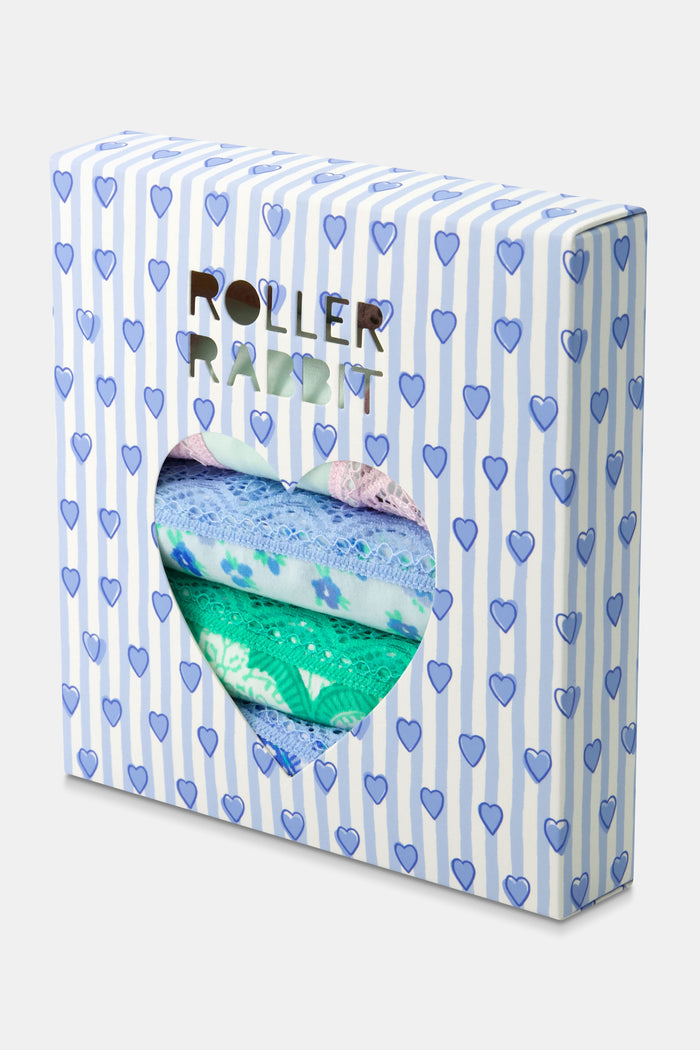 The Classic Core Bikini 4 Pack by Roller Rabbit includes four soft cotton modal panties, each with lace trim: green with hearts, light blue floral, white with blue paisley, and mint green with pink trim and embroidered hearts.