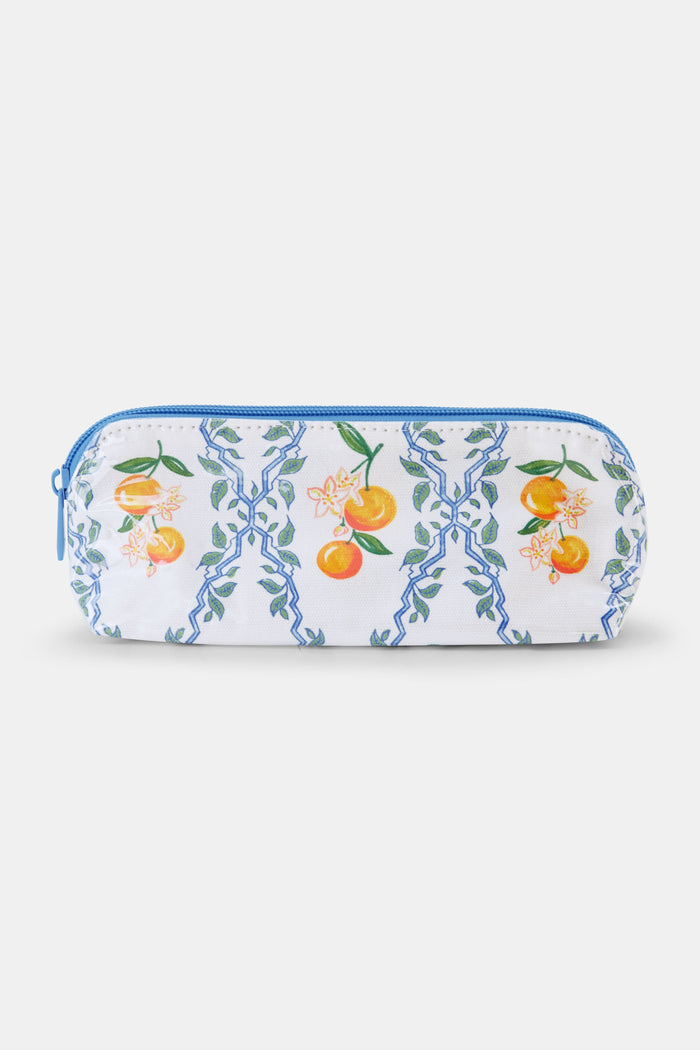 The Clementine Trellis Makeup Bag by Roller Rabbit is a zippered, water-resistant cotton canvas bag with a blue zipper and a white background featuring blue geometric lines, green leaves, orange fruits, and white flowers.