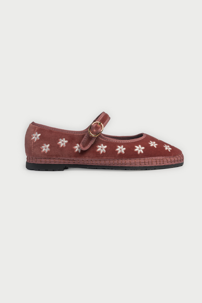 The FLABELUS Daisy Embroidery Mary Jane is a dusty pink velvet slipper with a strap and buckle, featuring small white floral embroidery along the side, shown against a plain white background.
