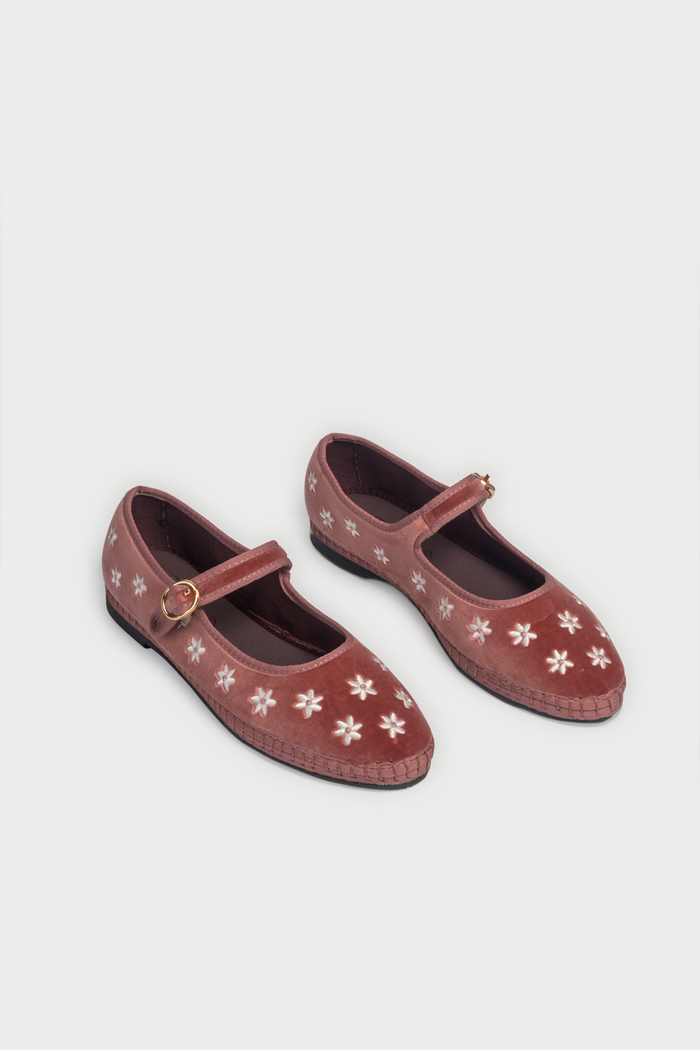 The FLABELUS Daisy Embroidery Mary Jane is a dusty pink velvet slipper with a strap and buckle, featuring small white floral embroidery along the side, shown against a plain white background.