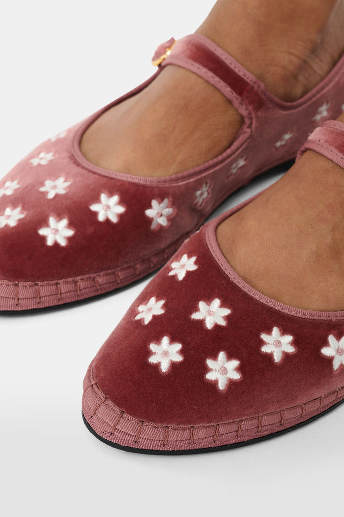 The FLABELUS Daisy Embroidery Mary Jane is a dusty pink velvet slipper with a strap and buckle, featuring small white floral embroidery along the side, shown against a plain white background.