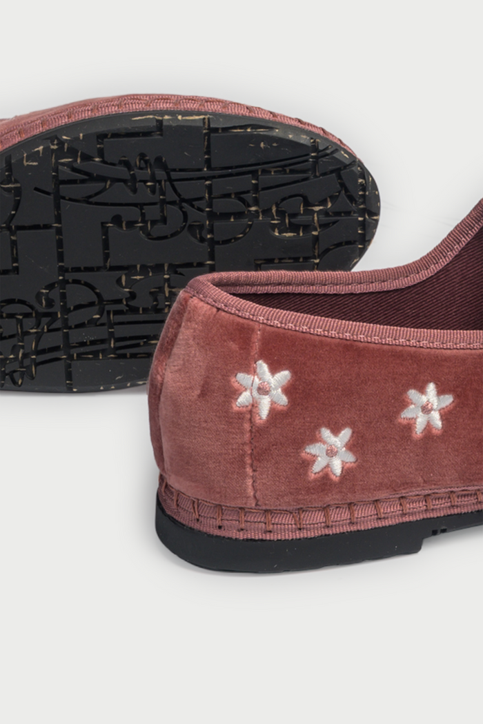 The FLABELUS Daisy Embroidery Mary Jane is a dusty pink velvet slipper with a strap and buckle, featuring small white floral embroidery along the side, shown against a plain white background.