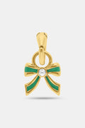 The MADISON 501 Enamel Bow Charm features green enamel ribbon accents and a white gemstone at the center, crafted from 14K Gold Covered Brass—a perfect holiday jewelry piece. Set against a plain white background.