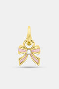 The Roller Rabbit Enamel Bow Charm features 14K gold-covered brass with light pink enamel accents and a small white central gem, photographed against a plain light background.