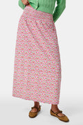 A Roller Rabbit Kids Garden Gate Floral Alexis Skirt with matching briefs, both showcasing a pink, green, and white flower pattern, is displayed on a plain white background. This cotton skirt is ideal for girls who love playful floral prints.