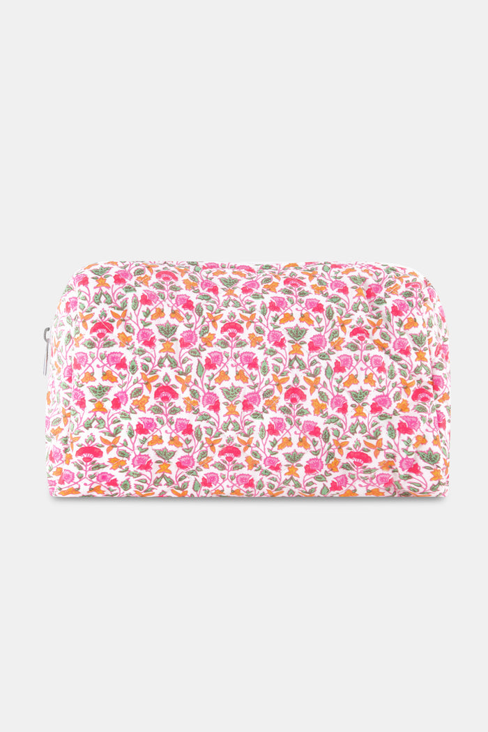 The Roller Rabbit Garden Gate Floral Quilted Makeup Bag is a rectangular, zippered bag crafted from 100 cotton and features a colorful floral print with pink, orange, and green flowers on a white background.