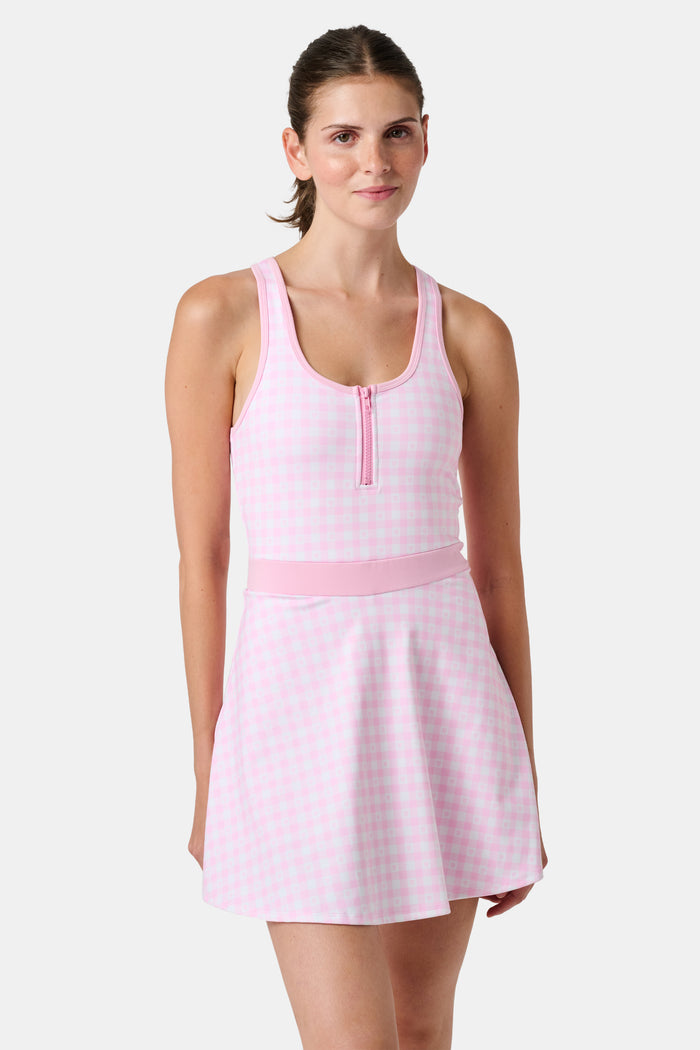 The Roller Rabbit Gingham Hearts Becky Active Dress is a sleeveless pink gingham dress featuring a fitted bodice, zipper front, and flared skirt, crafted from soft peached interlock fabric and shown on a plain white background.
