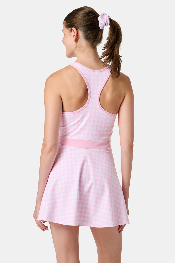 The Roller Rabbit Gingham Hearts Becky Active Dress is a sleeveless pink gingham dress featuring a fitted bodice, zipper front, and flared skirt, crafted from soft peached interlock fabric and shown on a plain white background.