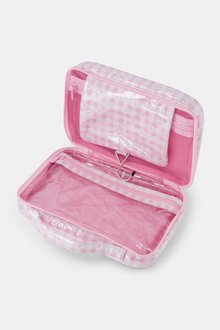 The Roller Rabbit Gingham Hearts Hanging Toiletry Case is a rectangular travel bag featuring pink and white gingham checks adorned with small heart patterns and a top handle, displayed against a plain white background.