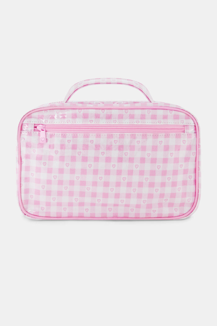 The Roller Rabbit Gingham Hearts Hanging Toiletry Case is a rectangular travel bag featuring pink and white gingham checks adorned with small heart patterns and a top handle, displayed against a plain white background.