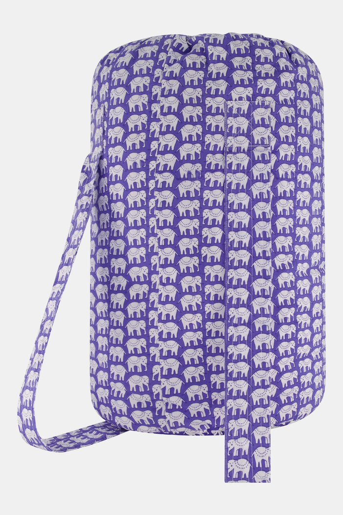 The Hathi Sleepover Bag by Roller Rabbit is a cylindrical purple kids’ sleeping bag featuring a white elephant pattern, front zippered pocket, and “!! Sleepover” label. The photo shows the bag on a plain white background.