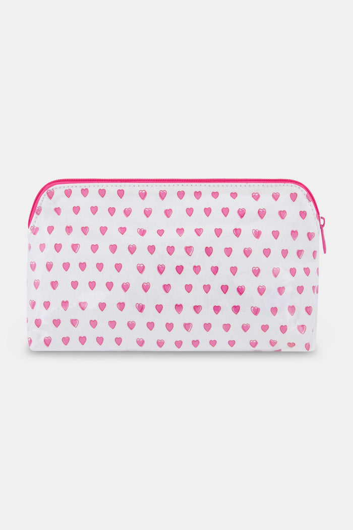 The Roller Rabbit Hearts Makeup Bag is a white, water-resistant canvas bag featuring a pink zipper and a pattern of small pink hearts.