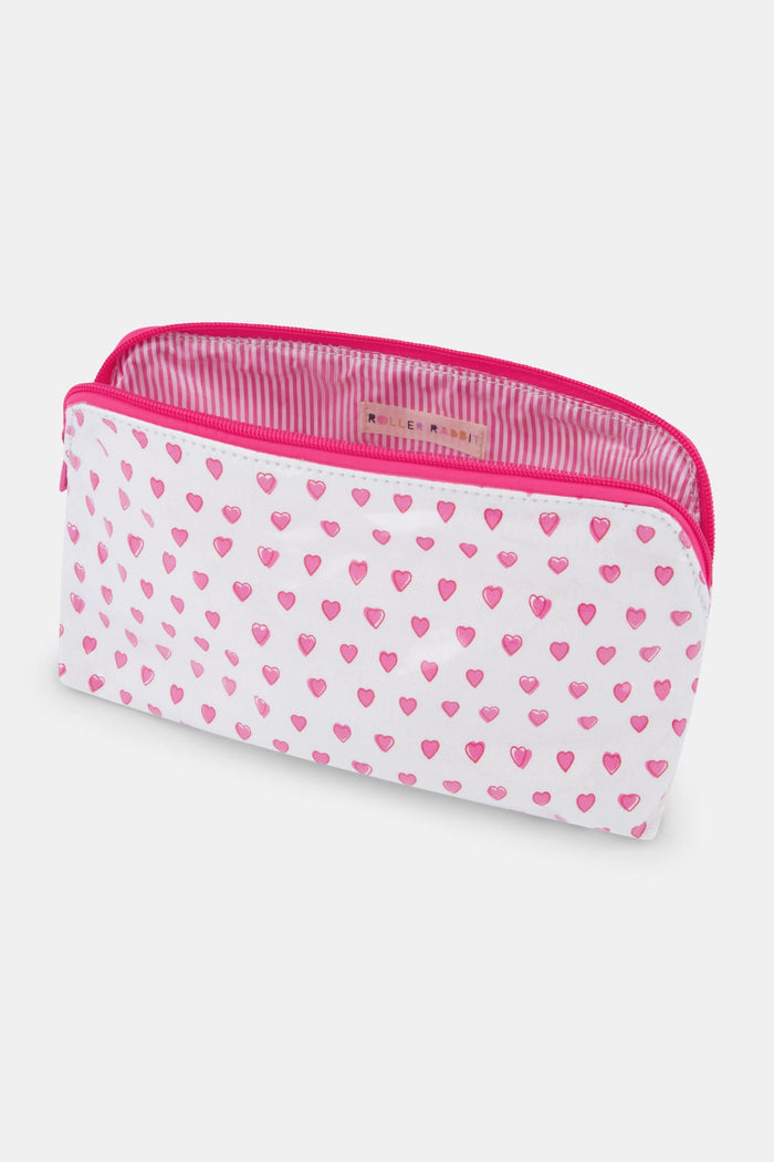 The Roller Rabbit Hearts Makeup Bag is a white, water-resistant canvas bag featuring a pink zipper and a pattern of small pink hearts.