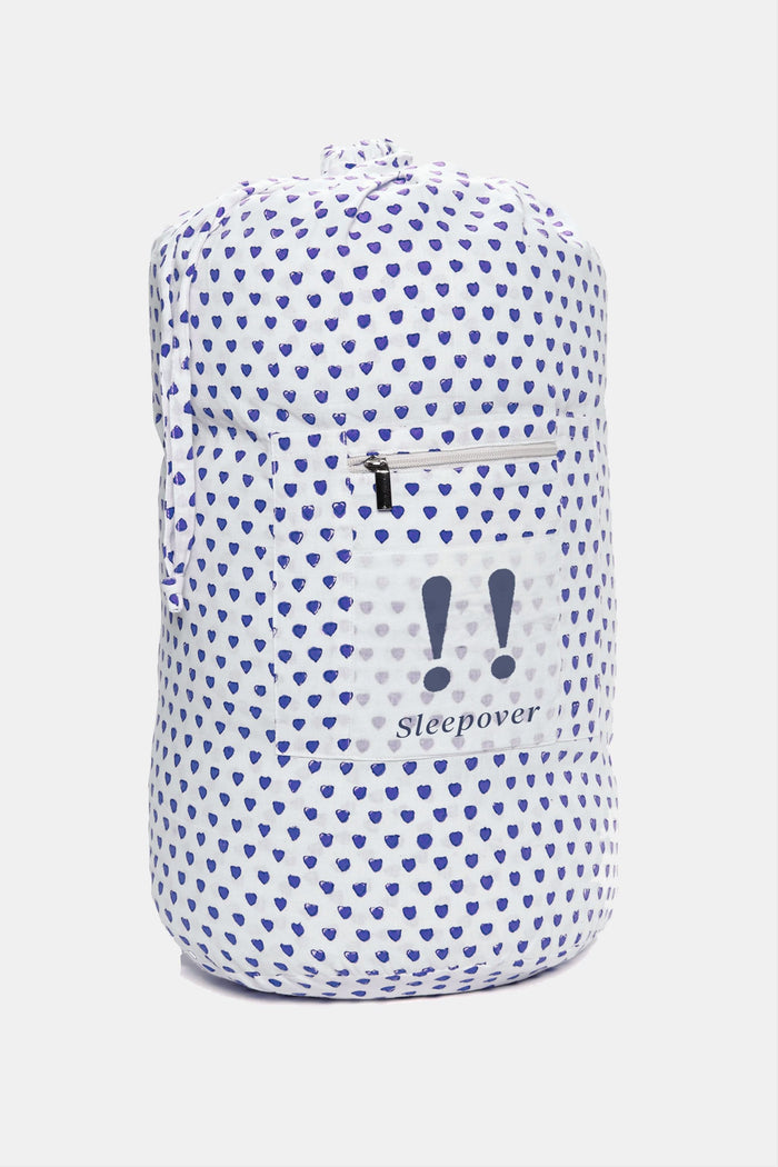 The Roller Rabbit Hearts Sleepover Bag is a large white bag with small blue hearts, a drawstring top, an external zippered pocket with two blue exclamation points, and "sleepover" printed below. Ideal for carrying kids' sleeping bags.