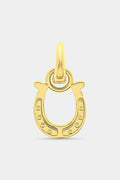 The Roller Rabbit Horseshoe Charm is a gold, horseshoe-shaped pendant designed as a luck charm, featuring a small loop at the top for attaching to a chain and set against a plain white background.