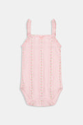 The Roller Rabbit Infant Daisy Heart Stripe Ava Onesie is a pink Pima cotton baby romper with thin shoulder straps, delicate ruffle details, and a subtle floral pattern. This sleeveless design features a small bow at the neckline and is shown against a plain white background.