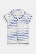 The Infant Hearts Polo Onesie by Roller Rabbit features a blue heart print, navy piping, a button-up front, and classic collar—offering a look inspired by playful blue heart rompers.