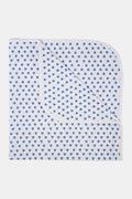 The Roller Rabbit Infant Hearts Receiving Blanket, made from soft Pima cotton, features small blue hearts and rounded corners. The blanket is shown folded at one corner to reveal both sides.