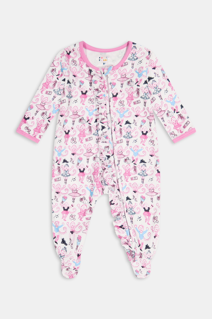 The Monkey Pirouette Polo Pajamas by Roller Rabbit feature a pink short-sleeve button-up top and matching shorts, adorned with a colorful and playful monkey, animal, and floral pattern on a white background.