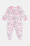The Monkey Pirouette Polo Pajamas by Roller Rabbit feature a pink short-sleeve button-up top and matching shorts, adorned with a colorful and playful monkey, animal, and floral pattern on a white background.