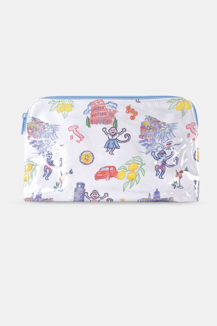 The Roller Rabbit Italy Monkey Makeup Bag is a white, water-resistant cotton canvas pouch with colorful Italian landmarks, lemons, monkeys, a red car, and a Vespa. A light blue zipper completes this playful makeup bag.