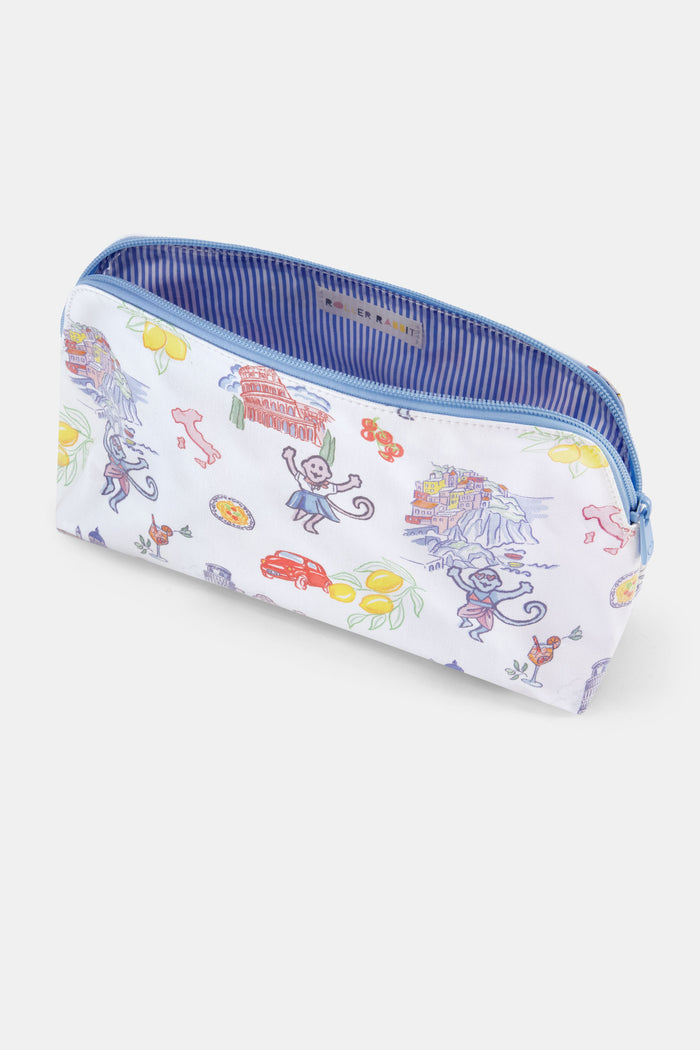 The Roller Rabbit Italy Monkey Makeup Bag is a white, water-resistant cotton canvas pouch with colorful Italian landmarks, lemons, monkeys, a red car, and a Vespa. A light blue zipper completes this playful makeup bag.