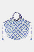 The Roller Rabbit Jemina Bondi Bag is a large blue and white cotton canvas tote with round striped handles, side tassels, and a scallop-inspired Jemina print—ideal for your next beach day.