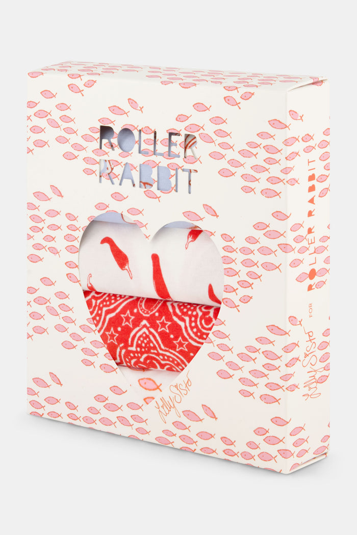 The Roller Rabbit Jet Set Thong 4 Pack features four lace-trimmed thongs—blue with hearts, pink with red lips, white with lips, and solid red—arranged in two rows on a white background.