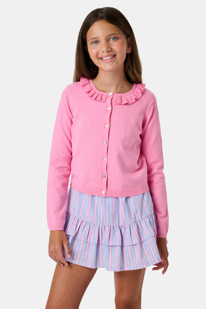 The Kids Ellis Cardigan by Roller Rabbit is a rose pink, long-sleeve cardigan featuring a ruffled collar and pearl-like buttons. Shown flat on a white background, it's made from soft cotton sweater material.
