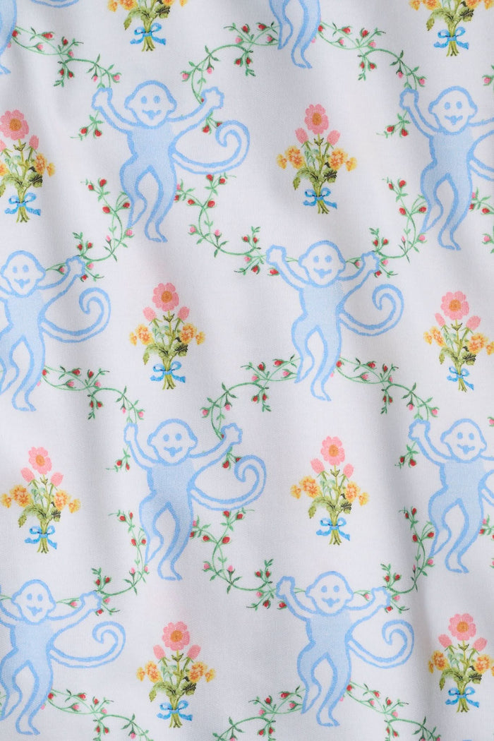 The Roller Rabbit Infant Floral Monkey Trellis Zipper Footie is a soft Pima cotton long-sleeve, footed onesie with a blue swirl and pink monkey floral trellis print on white, featuring a diagonal zipper from neck to left leg.