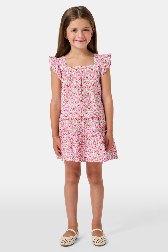 A Roller Rabbit Kids Garden Gate Floral Alexis Skirt with matching briefs, both showcasing a pink, green, and white flower pattern, is displayed on a plain white background. This cotton skirt is ideal for girls who love playful floral prints.