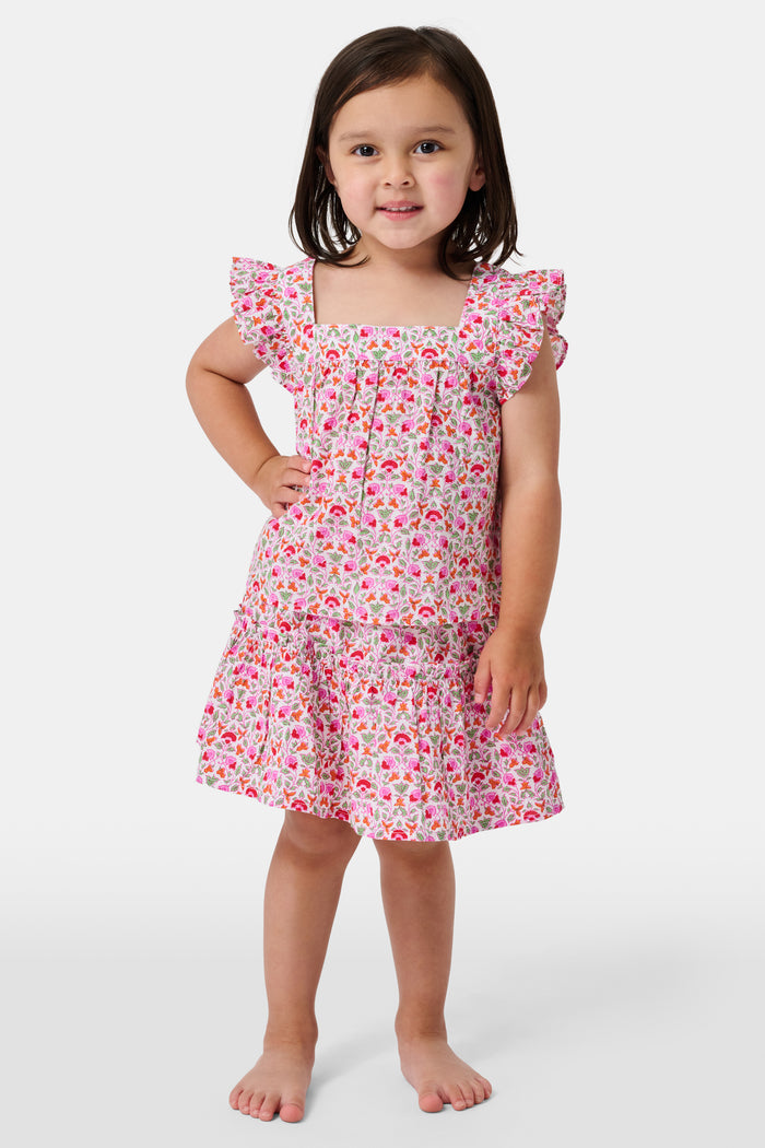 A Roller Rabbit Kids Garden Gate Floral Alexis Skirt with matching briefs, both showcasing a pink, green, and white flower pattern, is displayed on a plain white background. This cotton skirt is ideal for girls who love playful floral prints.