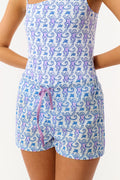 A child models the Roller Rabbit Kids Monkey Lounge Short—a matching pajama set with a blue and purple monkey print, sleeveless top, and cambric shorts with a purple drawstring—against a plain white background.