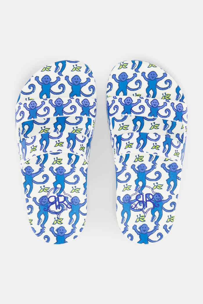 A pair of Roller Rabbit Kids Monkey Pool Slides with a blue and purple swirling floral pattern and green accents, shown side by side on a plain white background.