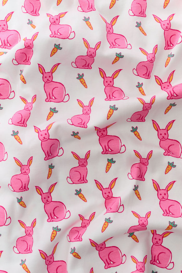 The Roller Rabbit Infant Romy the Rabbit Zipper Footie is a white Pima cotton pajama with long sleeves and pink bunny prints, featuring a convenient two-way front zipper closure.