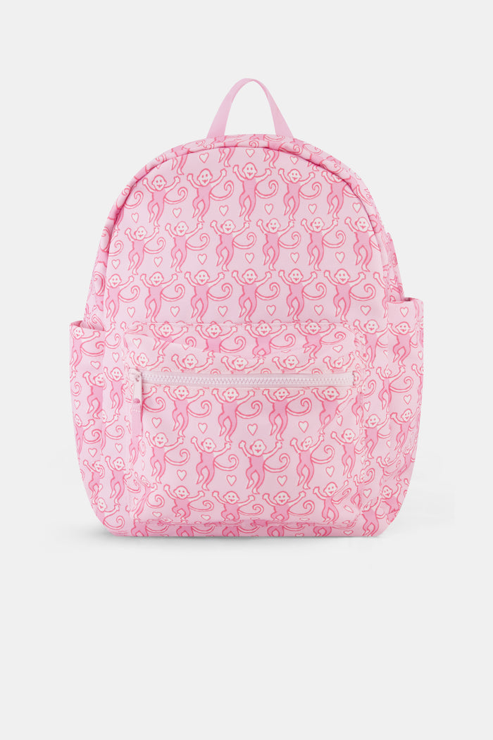 Introducing the Lovely Monkey Backpack by Roller Rabbit, showcasing a charming pattern of playful pink monkeys on a light pink background. Crafted from durable polyester, this backpack features a front zipper pocket, side pockets, and a top handle—all coordinated in matching pink hues.