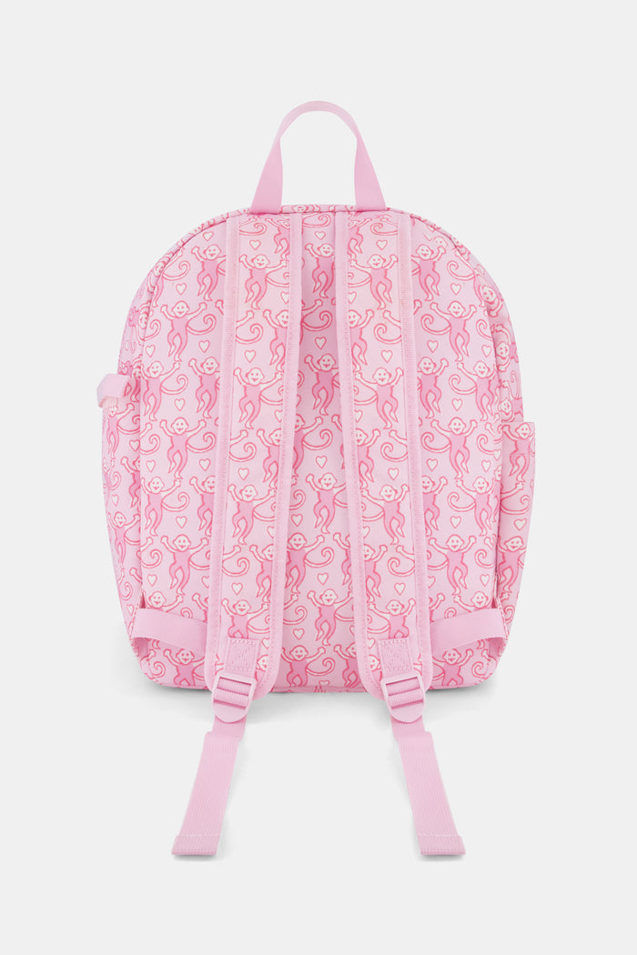 Introducing the Lovely Monkey Backpack by Roller Rabbit, showcasing a charming pattern of playful pink monkeys on a light pink background. Crafted from durable polyester, this backpack features a front zipper pocket, side pockets, and a top handle—all coordinated in matching pink hues.