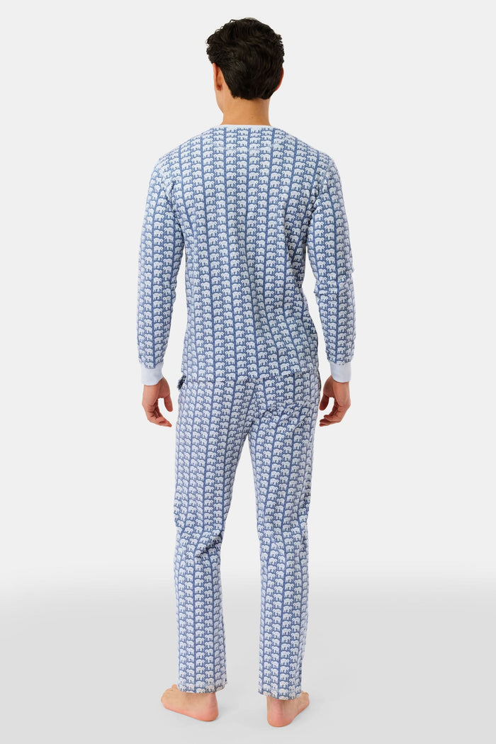 A man stands barefoot in Roller Rabbit's Mens Hathi Spencer Pajamas, a blue and white long-sleeve set with a small pattern and buttoned collar, made from 100 Pima Cotton, against a plain white background.