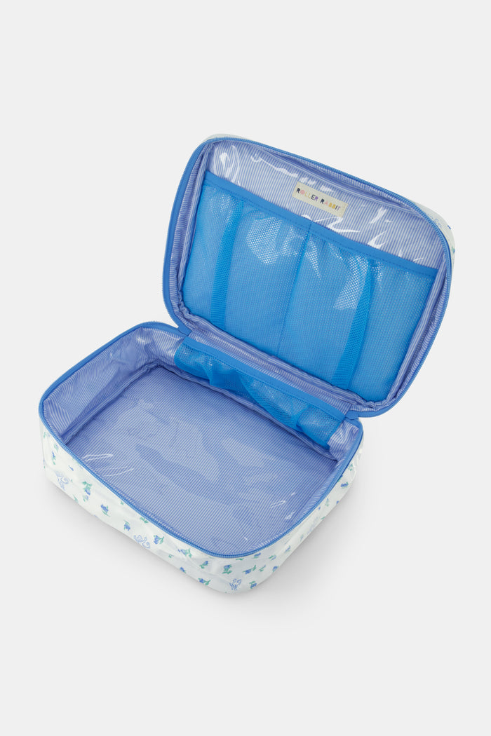 The Roller Rabbit Mini Monkey Blossom Carry All Case is a rectangular white fabric toiletry bag featuring a blue floral and monkey pattern, blue trim, a zip-around top closure, and a clear plastic handle on the lid.