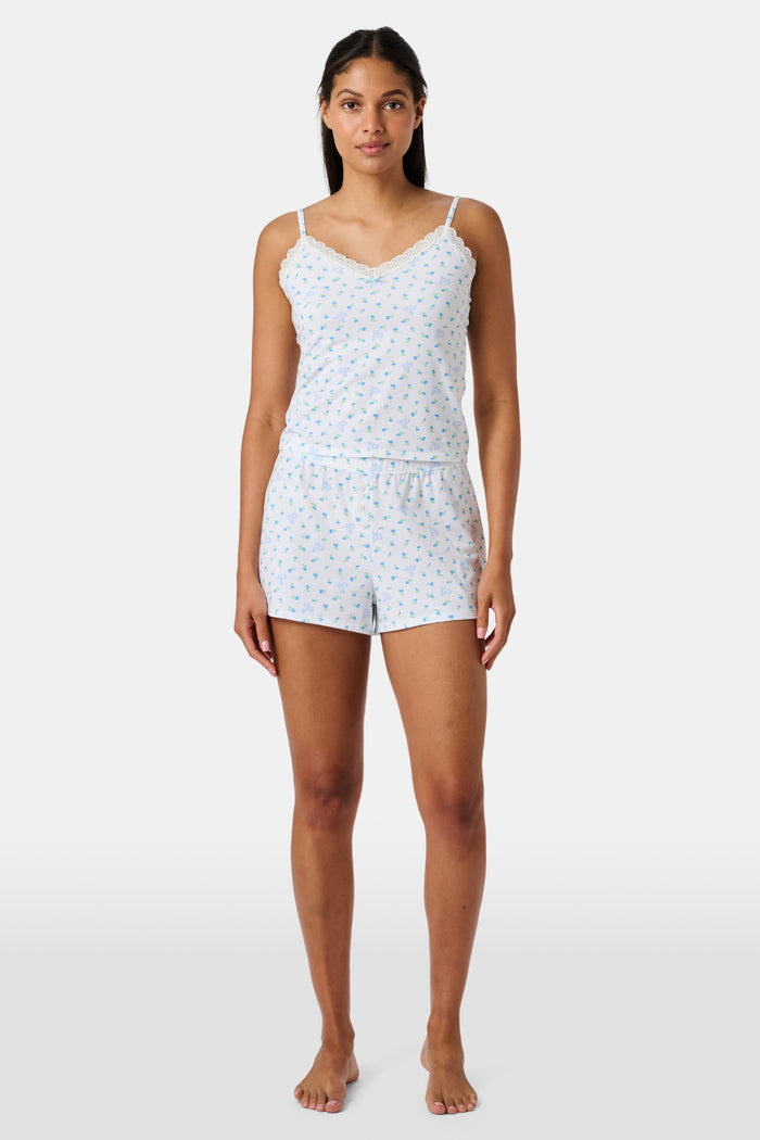 Introducing the Roller Rabbit Mini Monkey Blossom Jones Shortie, a white boxer short featuring a playful pattern of small blue and green turtles and rabbits. Crafted from soft cotton modal for a gentle feel and relaxed fit, this short is showcased against a simple light background.
