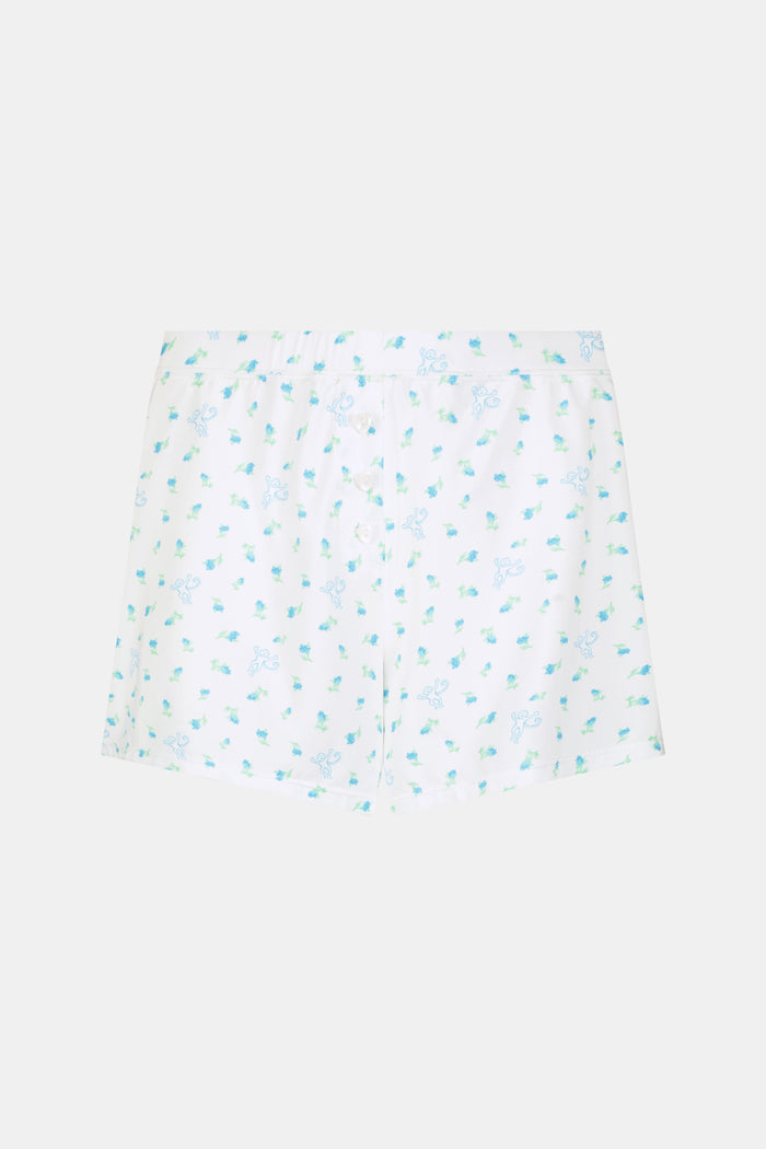 Introducing the Roller Rabbit Mini Monkey Blossom Jones Shortie, a white boxer short featuring a playful pattern of small blue and green turtles and rabbits. Crafted from soft cotton modal for a gentle feel and relaxed fit, this short is showcased against a simple light background.