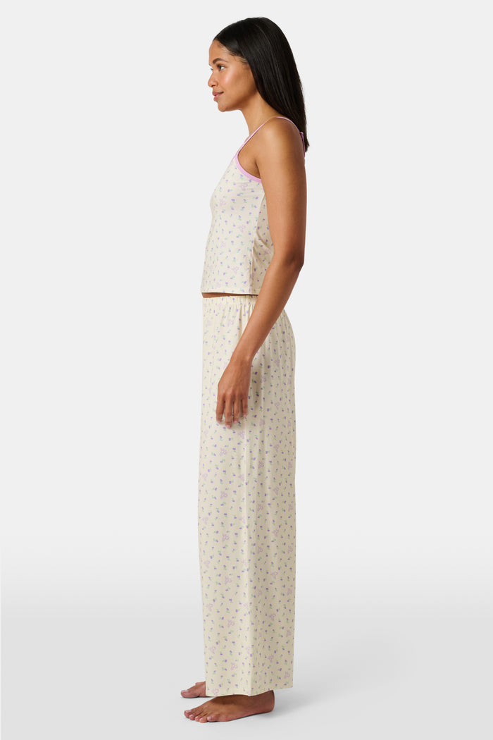 Yellow wide-leg pajama pants with a small yellow floral print pattern, crafted from a soft cotton modal blend, shown on a white background. These comfortable Roller Rabbit Mini Monkey Blossom Monroe Pants are perfect for relaxing at home.