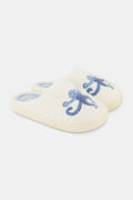 The Roller Rabbit Monkey Star Fuzzy Slipper features cozy blue fuzz, a light blue lining, cute embroidered monkey designs on top, and a durable rubber sole.