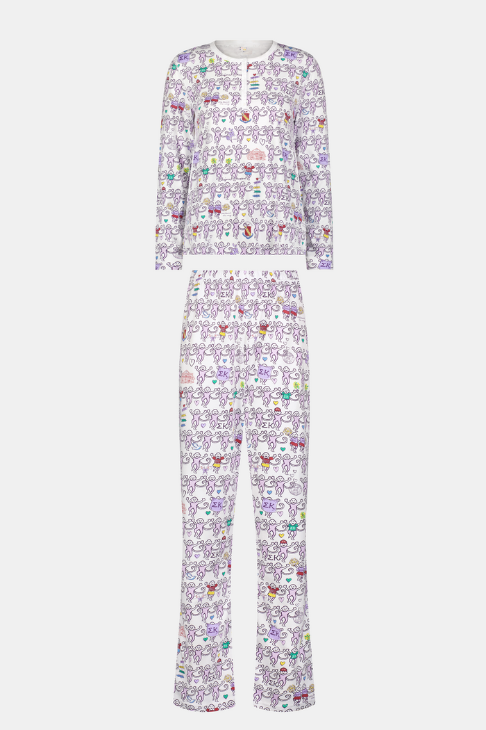 The Sigma Kappa Monkey Pajamas by Roller Rabbit is a long-sleeve set featuring a buttoned top and comfortable elastic waist, decorated with an all-over pattern of colorful cartoon monkey faces on a white background.