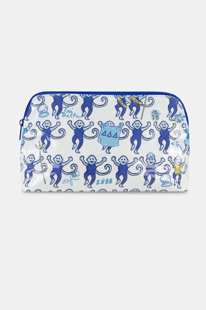 The Roller Rabbit Tri Delta Monkey Makeup Bag is a white zip pouch crafted from cotton canvas and finished with a protective, easy-to-clean coating. It features blue cartoon monkeys—some holding flags or signs—alongside “Tri Delta 1888” text in blue, all arranged in a playful repeating pattern across the bag.
